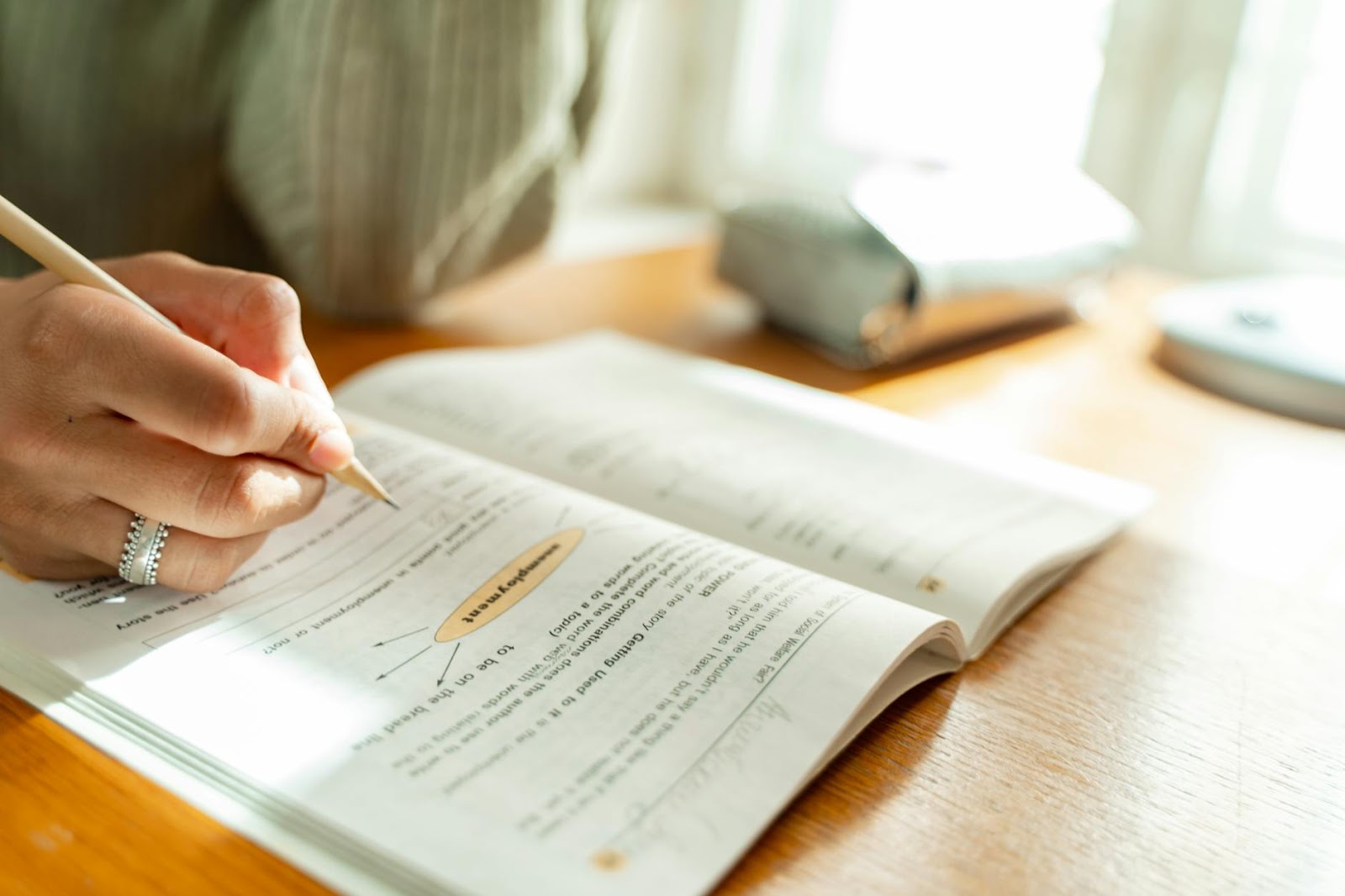 https://www.pexels.com/photo/person-answering-a-textbook-9490246/